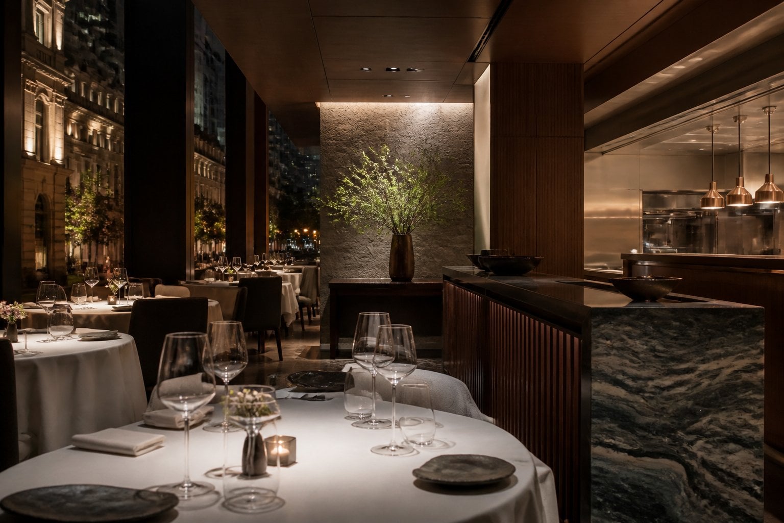 An elegant fine-dining restaurant interior with polished tables, warm lighting, and modern decor.